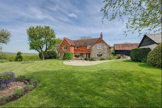 A delightful former farmhouse set in a quiet hamlet, with elevated Chilterns views all aro