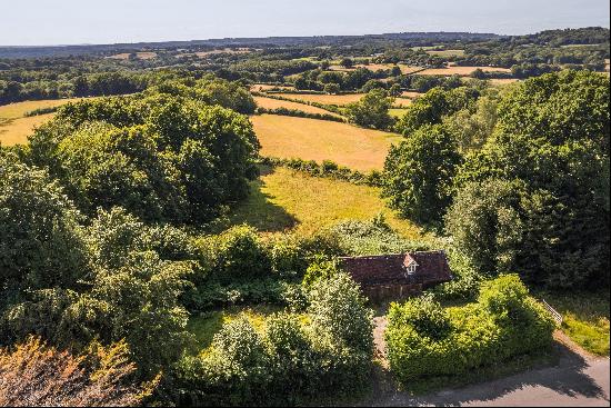 An attractive Grade II listed unconverted stable/barn with Planning Permission to convert 