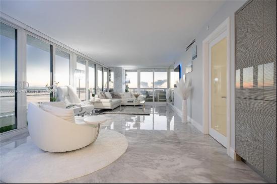 Welcome to the ABSOLUTE BEST corner unit in Edgewater with PANORAMIC VIEWS of the Intracoa