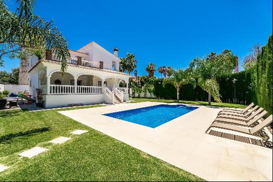 A spacious villa with a beautiful garden.