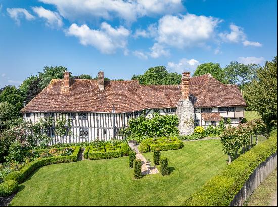 A beautifully restored important listed Tudor house set in exquisite gardens and grounds.