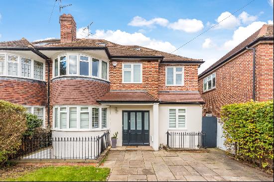 A beautiful six bedroom family home on Lauderdale Drive, TW10.