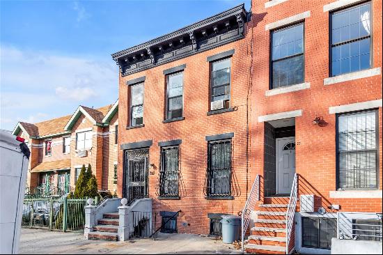 This stunning attached brick two-family home on the border of Stuyvesant Heights and Ocean