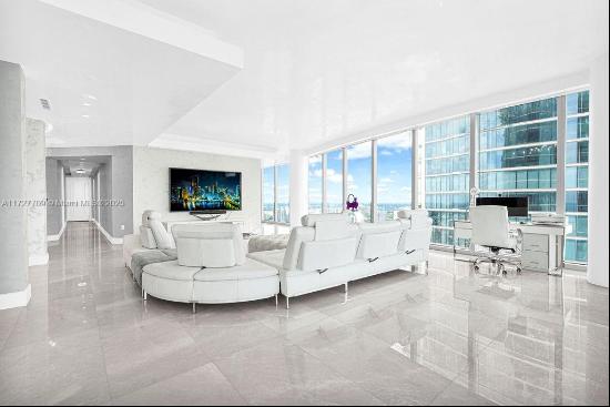 Welcome to the prestigious Estates at Acqualina, featuring a stunning NE corner unit with 