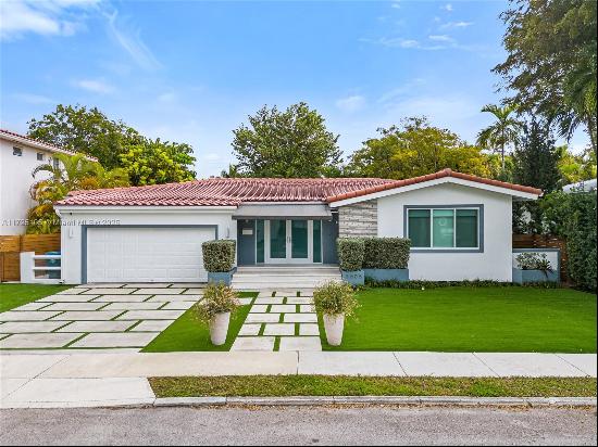 Step into this charming Mid-century modern 3bed/2bath home in the most prestigious NE Coco