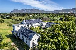 PARADISAL RESIDENCE ON SPRAWLING GROUNDS IN THE COVETED CONSTANTIA VALLEY.