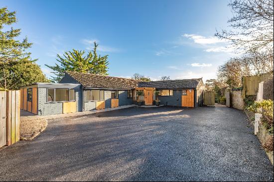 An imaginatively and recently renovated house on two levels set in just under an acre in a