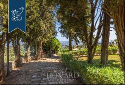 Elegant renovated villa surrounded by olive trees for sale on the outskirts of Florence