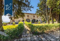 Elegant renovated villa surrounded by olive trees for sale on the outskirts of Florence