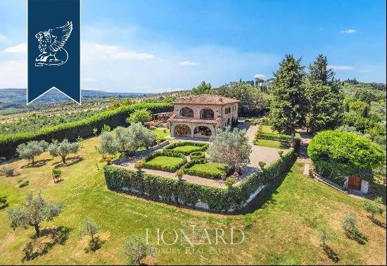 Elegant renovated villa surrounded by olive trees for sale on the outskirts of Florence