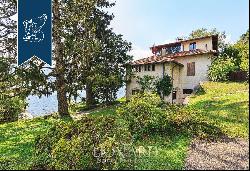 Unique property in the town of Griante for sale with a private dockyard and beach