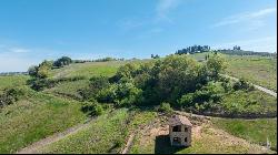 Giotto country house with loggia and garden near Montalcino, Siena