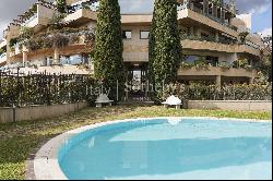 Apartment with garden and communal swimming pool