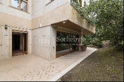 Apartment with garden and communal swimming pool