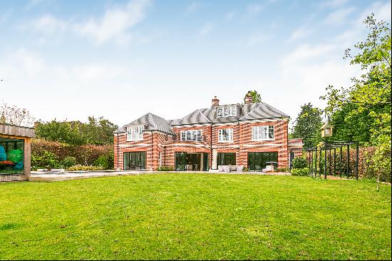 Stunning family home with private swimming pool for sale in Oxshott