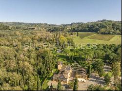 Farm surrounded by greenery in a beautiful valley