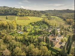 Farm surrounded by greenery in a beautiful valley