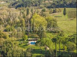 Farm surrounded by greenery in a beautiful valley