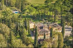 Farm surrounded by greenery in a beautiful valley