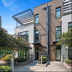 Newer End Unit Townhome with Elevator in Upscale Community