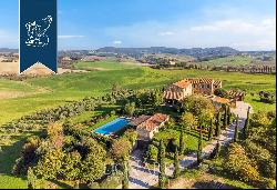 Luxurious agritourism resort with an olive grove and a view of the Crete Senesi for sale