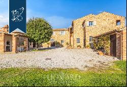 Luxurious agritourism resort with an olive grove and a view of the Crete Senesi for sale