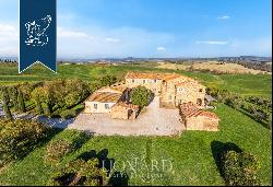 Luxurious agritourism resort with an olive grove and a view of the Crete Senesi for sale