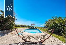 Luxury villa with a pool in an exclusive position by the sea for sale in the province of A