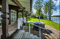 Homestead in ethnographic style on the shore