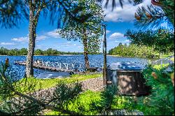 Homestead in ethnographic style on the shore