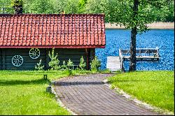 Homestead in ethnographic style on the shore