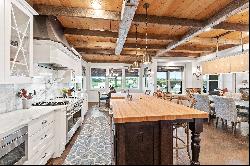 Be blown away by cathedral ceilings clad in reclaimed wood and hand-hewn beams..