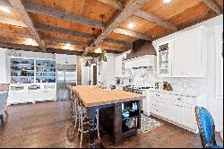 Be blown away by cathedral ceilings clad in reclaimed wood and hand-hewn beams..