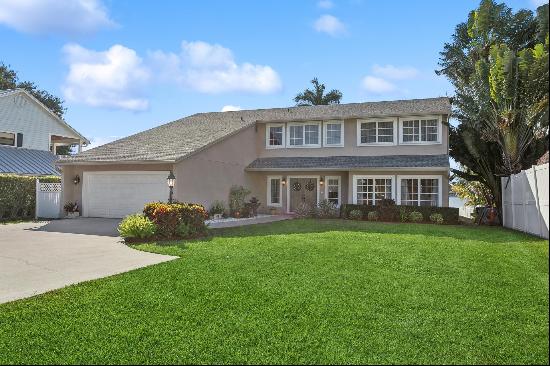 Welcome to this Stunning Remodeled Lakefront Oasis with Timbertech Dock, Deck, Lift & Pool