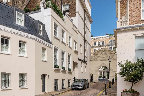 A two/three bedroom mews freehold house with a decked roof terrace for sale in South Kensi