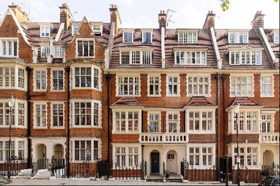 A well-appointed apartment set in a handsome red brick building in central Kensington, W8.