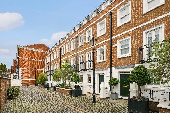 An impressive four-bedroom house in the highly sought after gated development Kensington G