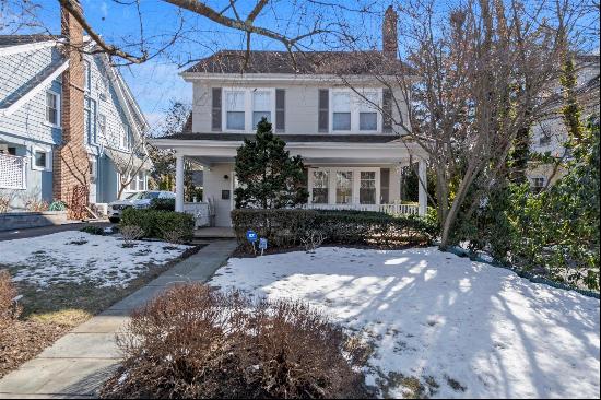 This beautifully maintained Port Washington Heights Dutch Colonial, built in 1920, feels l