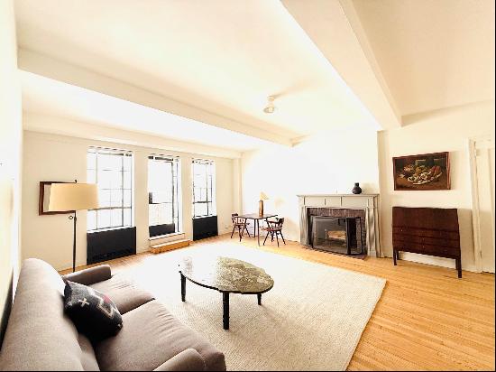 Experience the height of luxurious living in this elegant pre-war condominium, complete