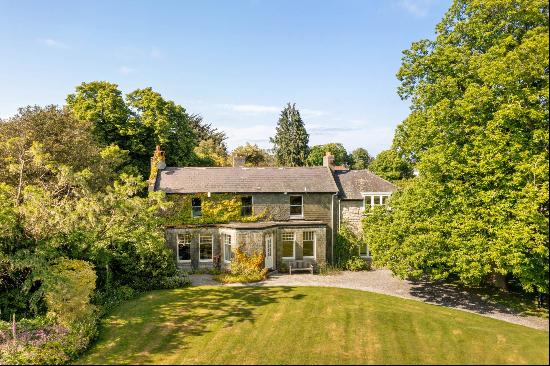 A charming five-bedroom, double fronted Georgian house built circa 1840 with a mix of slat