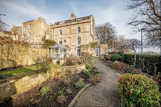 A unique and impressive, Grade II listed, semi-detached Georgian home with garages and gar