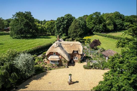 An idyllic Grade II Listed thatched cottage with a separate annexe and Rose Lodge situated