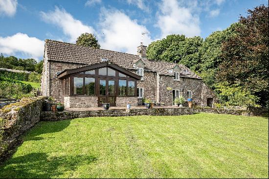 A glorious period barn conversion covering approximately five acres, sitting on the fringe