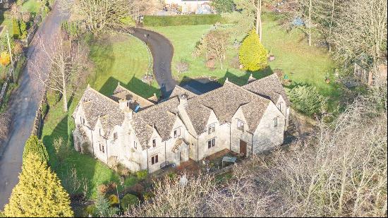 An attractive Cotswold Stone four bedroom period country home with an annexe/flat set in l