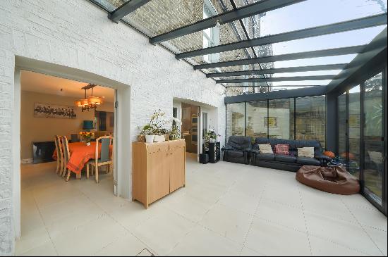 A charming four bedroom garden flat which is spread across two floors.