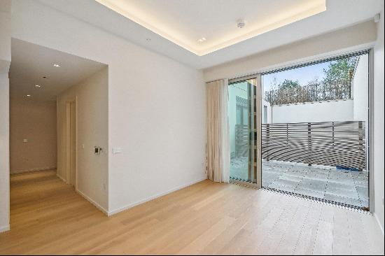 Modern luxury with a private patio in the heart of Lillie Square.