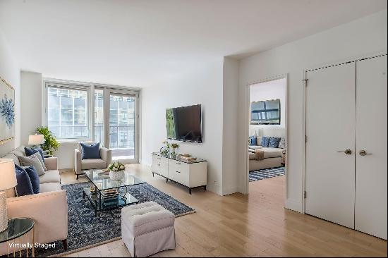 Residence 6F at L'Ecole Condominium is a spacious 2-bedroom, 2-bath home featuring the 