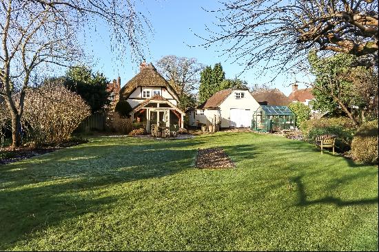 A detached Grade II listed cottage located in a sought-after village.