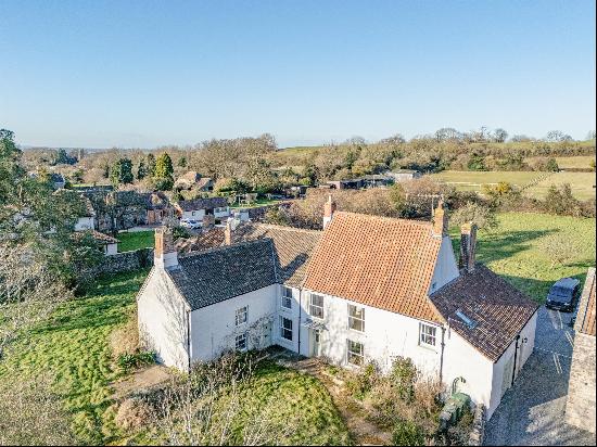 A charming 17th detached Grade II listed village house adjoining farmland with a south fac