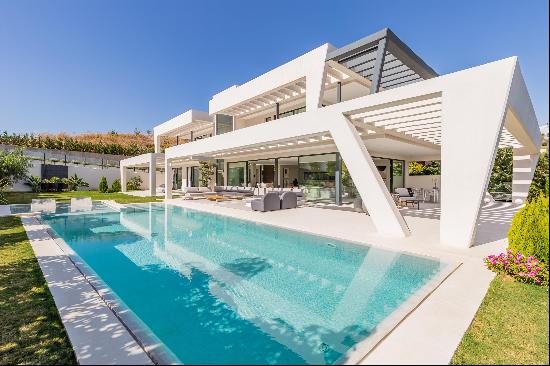 An elegant, modern villa with ample natural light and brilliant outdoor spaces.